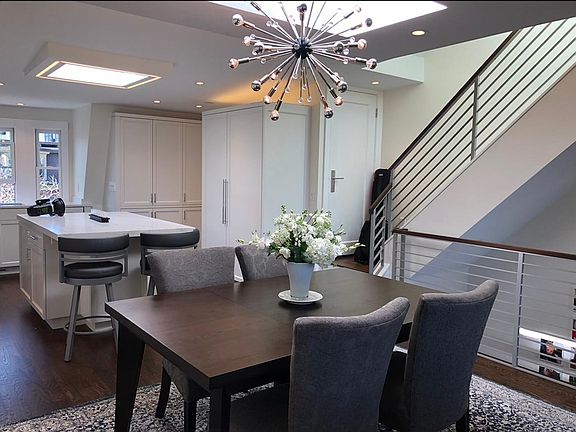 Dining and kitchen plus stairs to roof deck