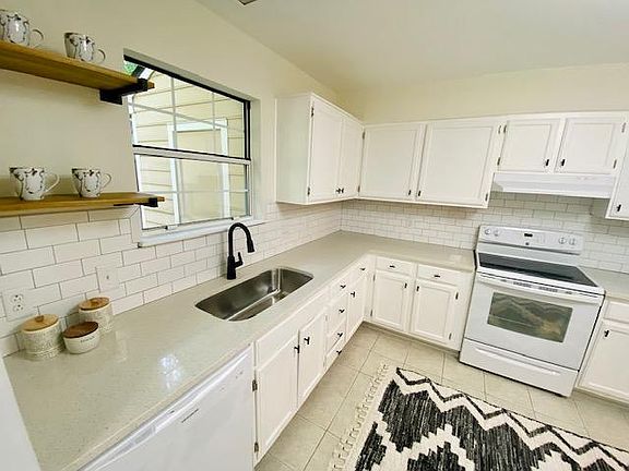 Modern floating shelves make a great area for a coffee station