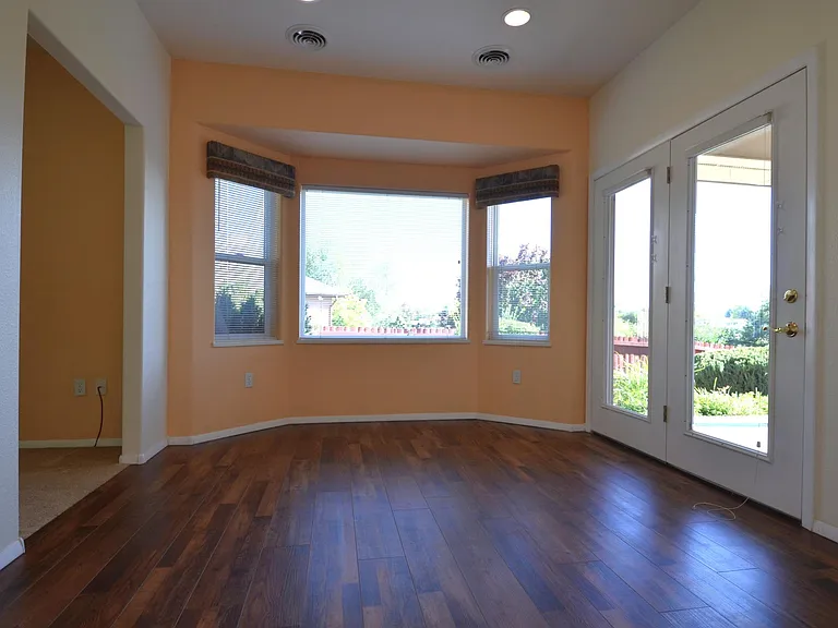 Dining Room with French Glass Doors & Bay Windows..