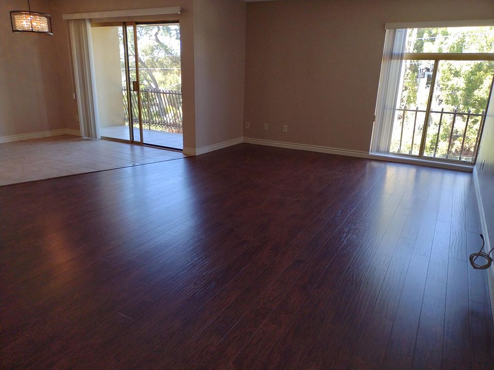 Volumnuous Living Room/Dining Room with brand new planked flooring Leading out to Balcony. Plenty of Sunlight.
