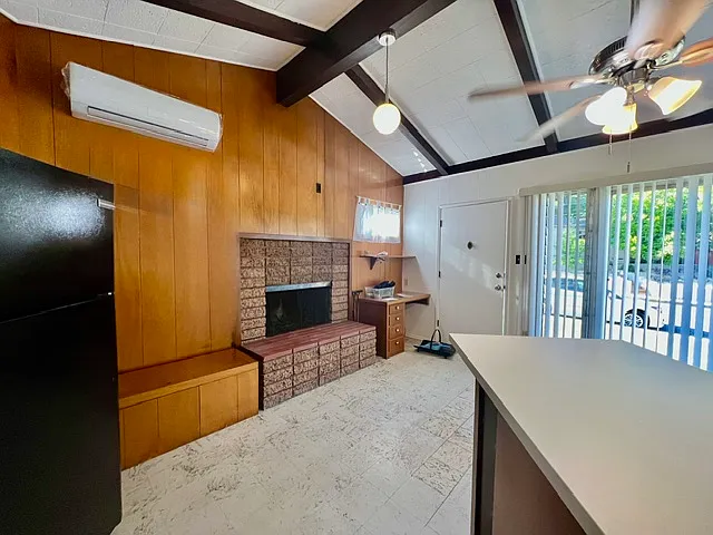 Front entryway, desk, movable bar, fireplace, AC unit