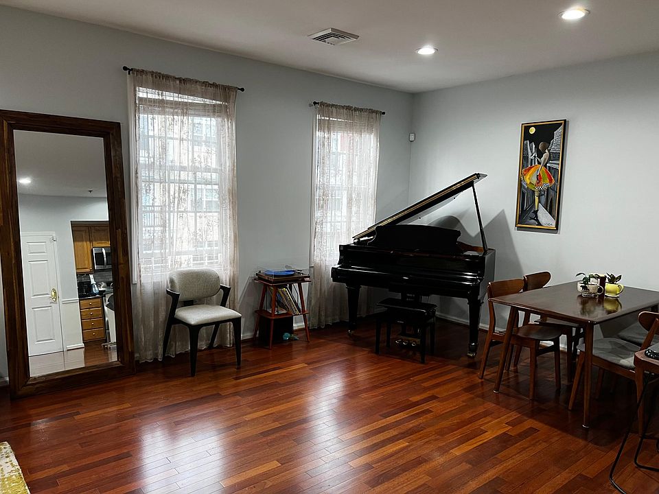 Baby grand piano in dining room