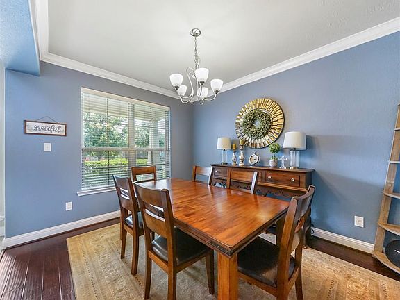 The Formal Dining room is to the left as you enter the home! Just the room you want guests to see first when they enter your gorgeous home.