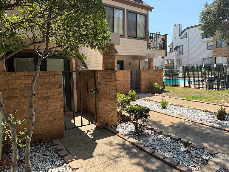 Entryway with view of secondary pool.