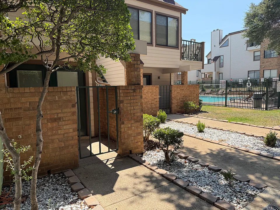 Entryway with view of secondary pool.