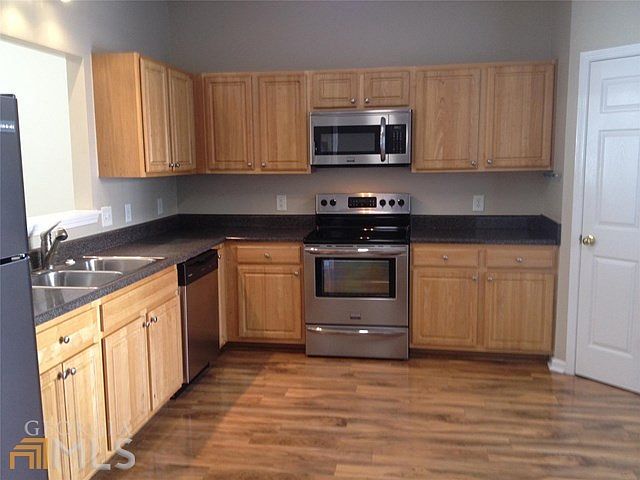 Large kitchen with stainless steel appliances