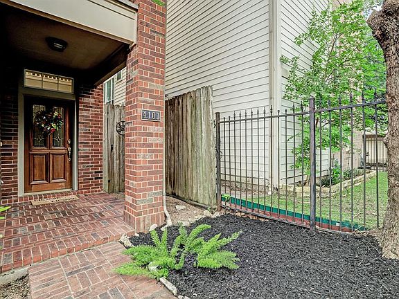 Enter into your new home though the front gated courtyard.
