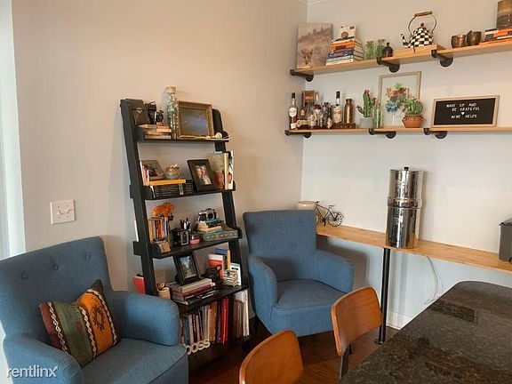 Open shelving with a built in desk can be used as a dining area or office area.