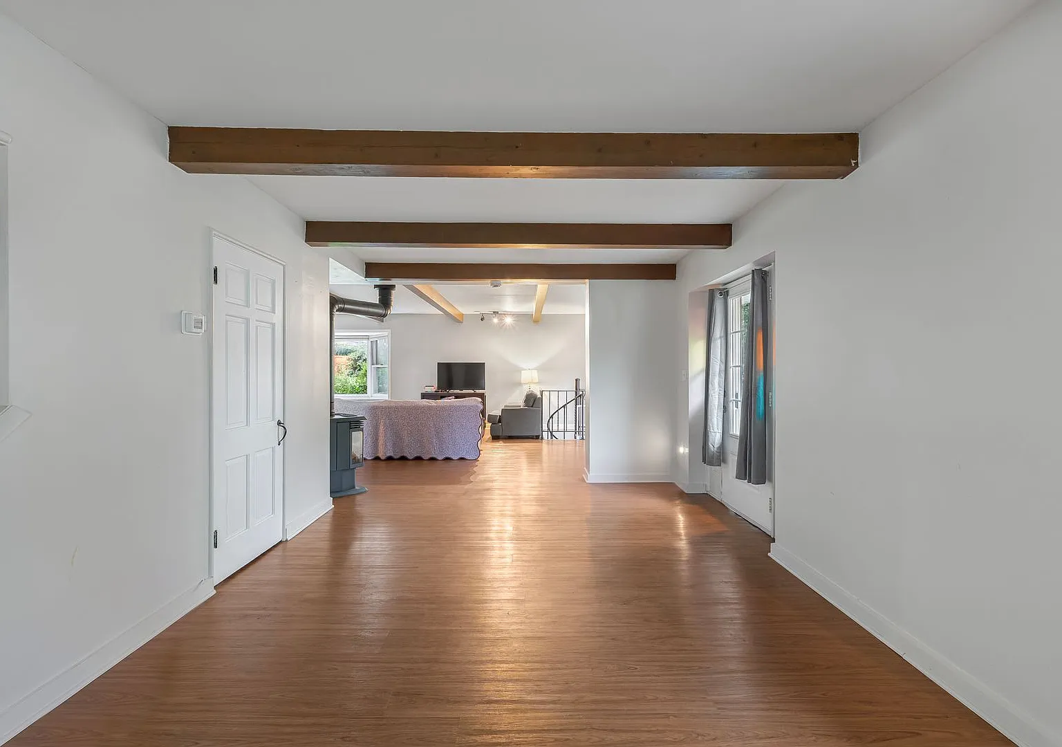 Home-Like Living with Sunroom, Attached Garage & In-Unit Laundry — Photo 4