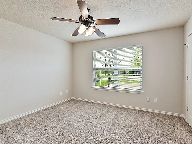 Each room has 2 inch faux wood blinds and a ceiling fan