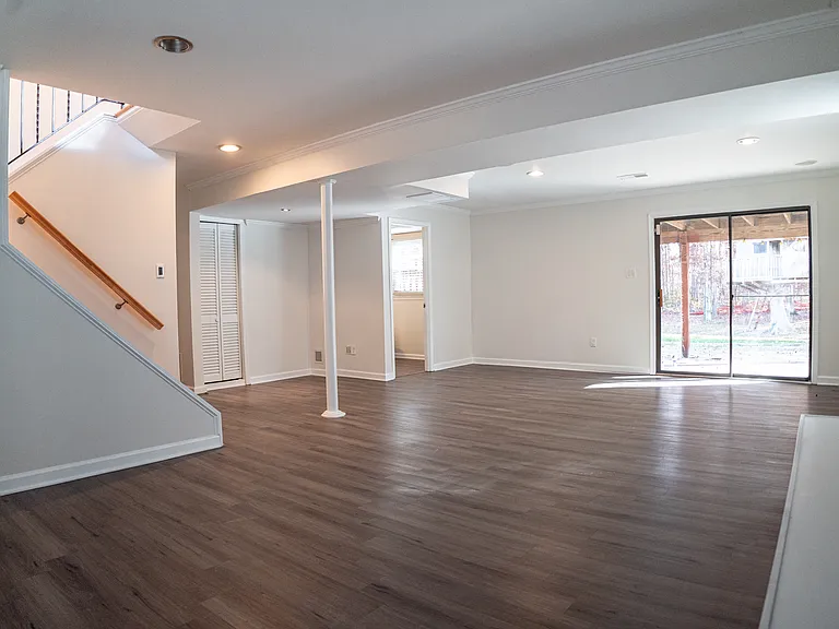 Basement Media Room, Bathroom, and Fireplace Sitting Area
