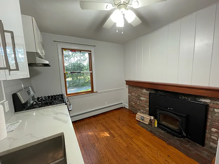 Lovely fire place and space for a small table/desk