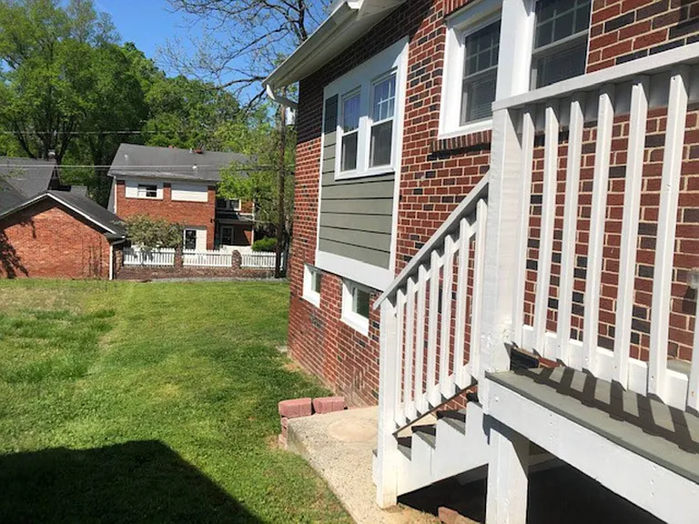Side porch off kitchen looking toward back yard