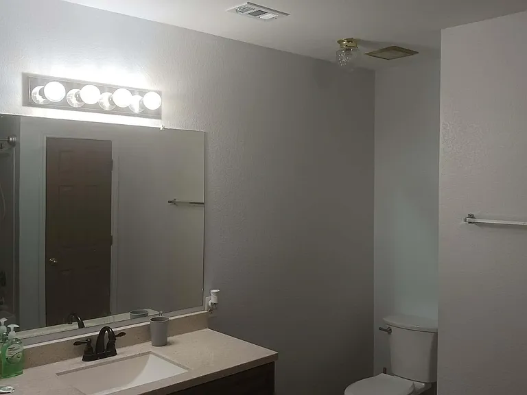 Private bathroom bedroom 2. Large single sink vanity.