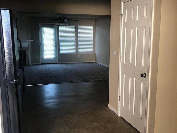 Entry looking into the Kitchen and Living Room. Stairs to th