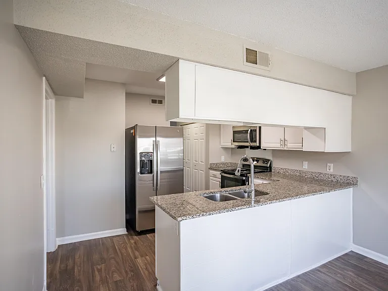 Kitchen with granite counters and modern cabinetry