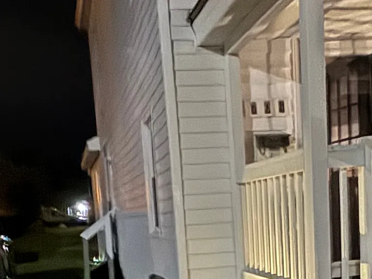 Beautiful side door to enter house lit up at night