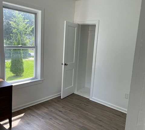 bedroom w/ new flooring