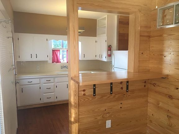 Open concept kitchen and rock maple serving and dining bar