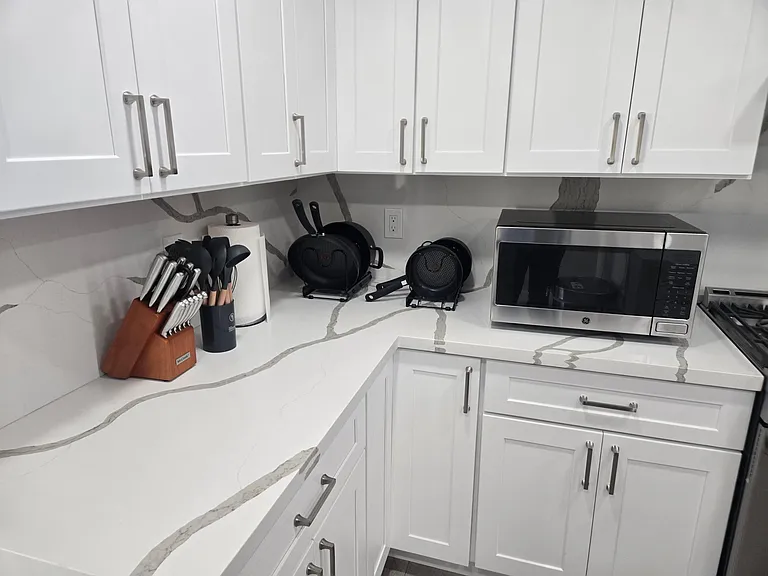 Cutlery, paper towels, and cookware are available
