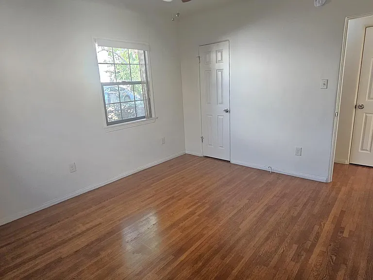 Bedroom with walk in closet in the middle.
