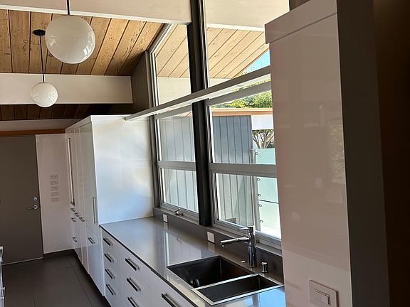 Kitchen with hidden appliances- built in refrigerator and dishwasher