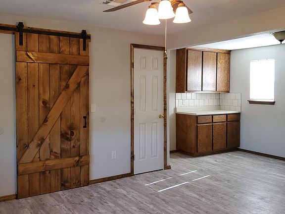 barn door opens to reveal laundry room