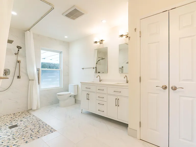 Master bathroom with roll in shower.