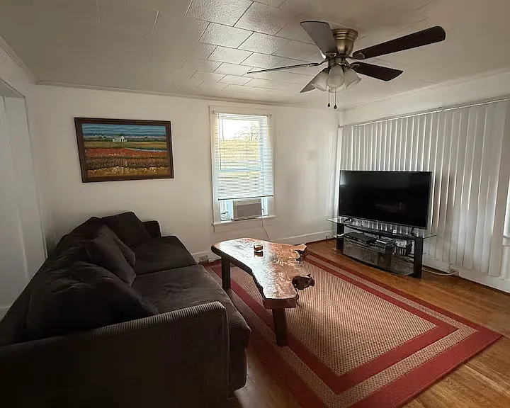 Living Room:
Step into a bright and inviting living space featuring freshly painted walls, large windows that fill the room with natural light, and durable flooring perfect for everyday living.