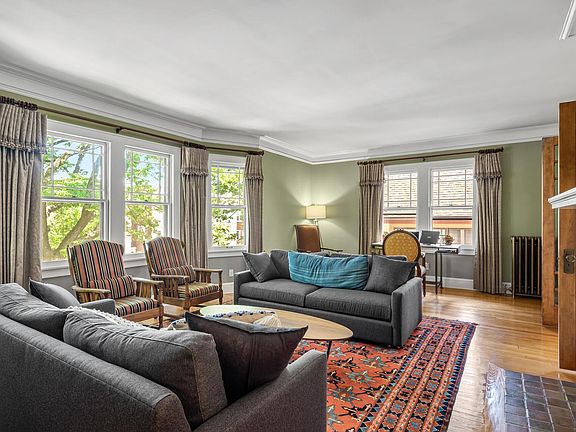 Main floor Living room with fireplace and french doors.
