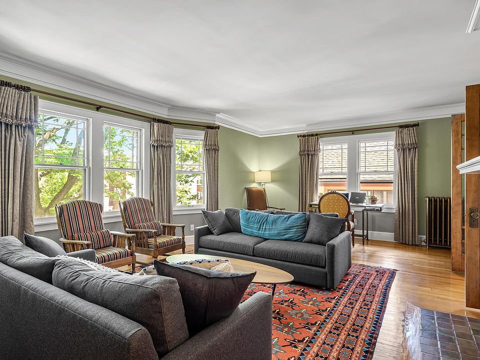 Main floor Living room with fireplace and french doors.