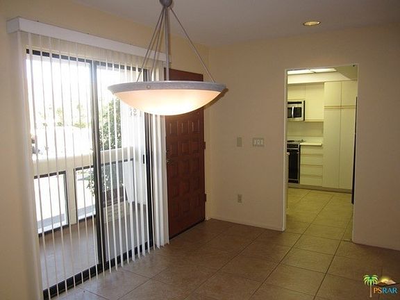 Dining with view to front entry balcony
