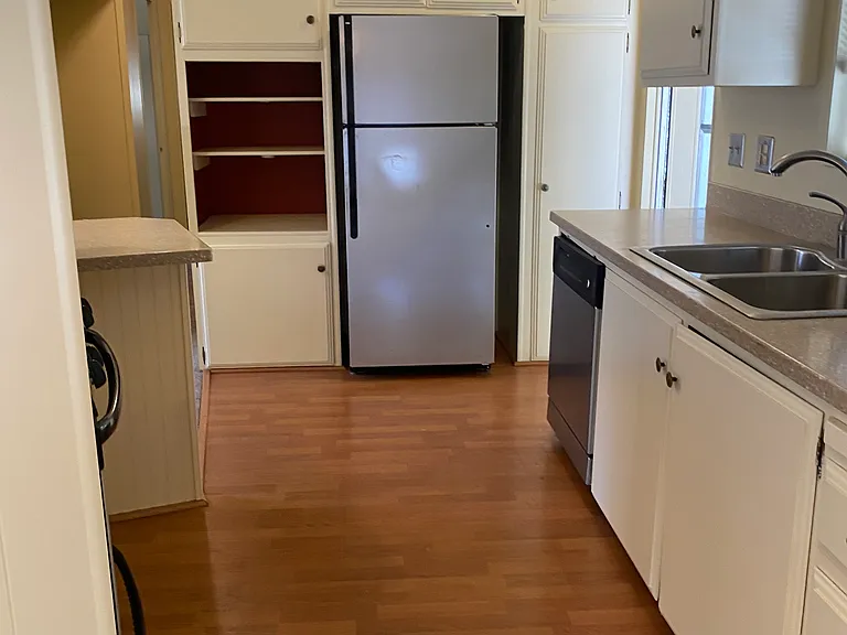 Nice kitchen with a dishwasher,gas stove,pantry and tons of cupboards.