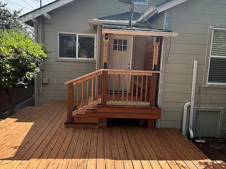 Brand-new backyard deck with inlaid entry bench.