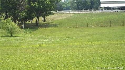 Sit on the covered back porch and enjoy the view.