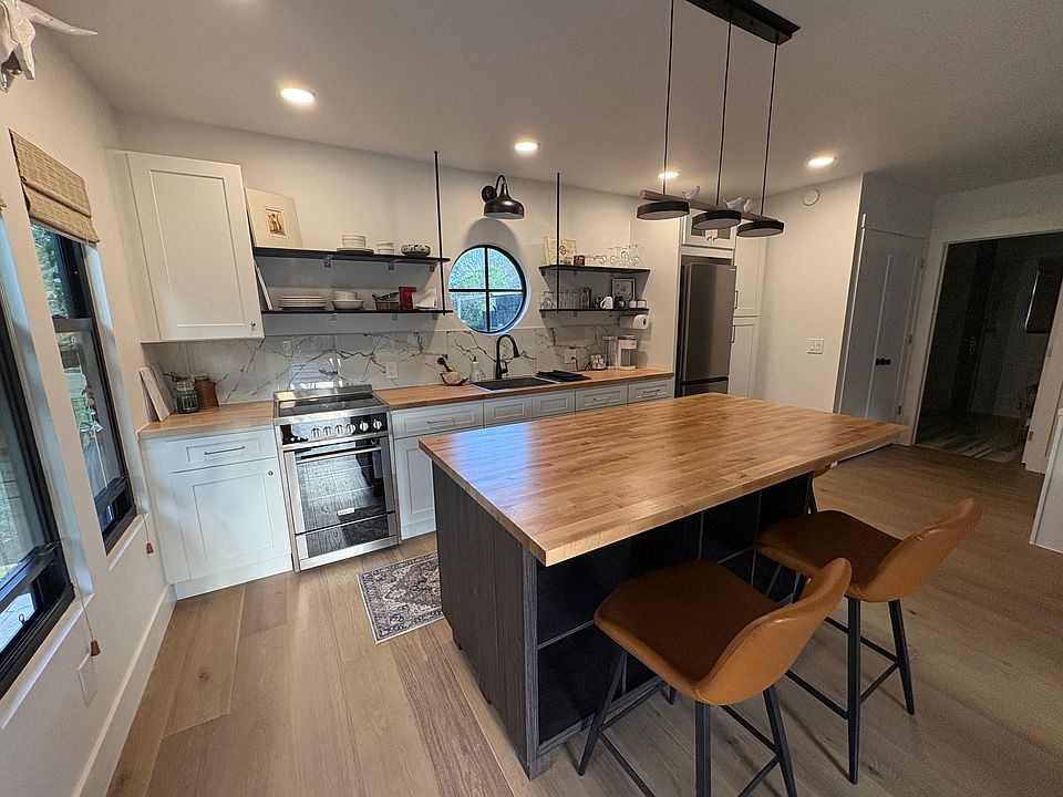 Complete kitchen - including full refrigerator, stove, microwave, kuerig