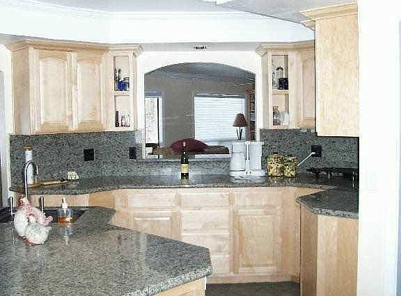 Remodeled kitchen showing pass-thru to living room