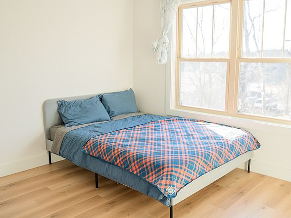 Guest bedroom includes a private en_suite bathroom and large closet.