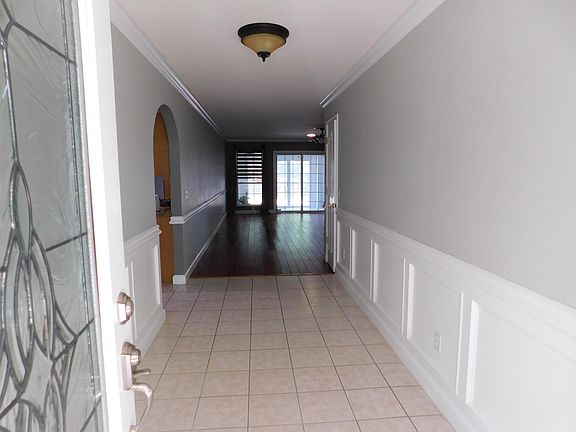 Entry way leading into Great Room with wood burning fireplace