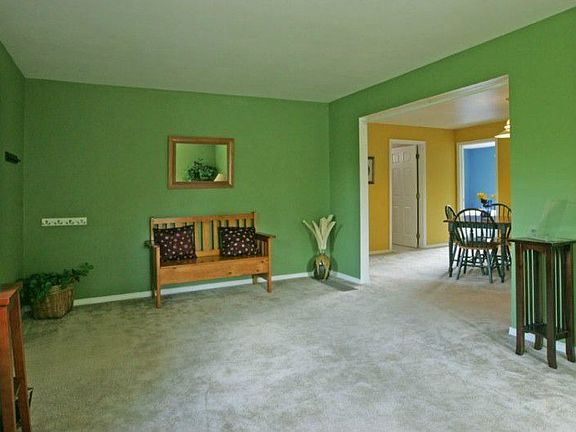 Lightfilled Living Room opens to Dining Room.
