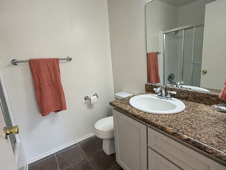 Bathroom in 2nd bedroom with granite counter tops