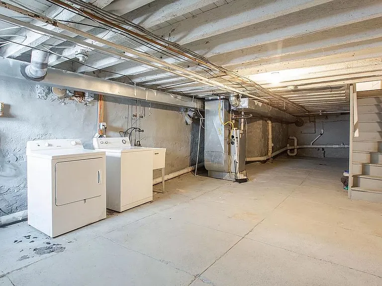 Unfinished Basement with W/D and French Drain.