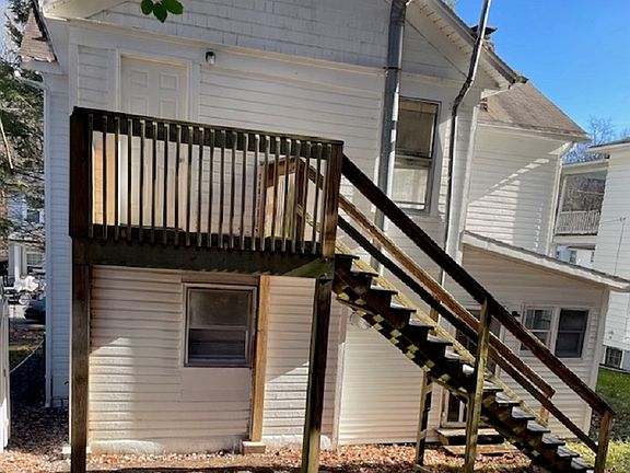 Rear view of the house with access to back deck from ground level from kitchen and upstairs.