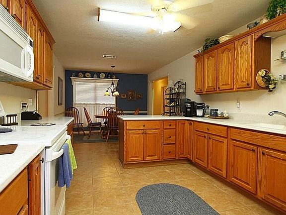  Large kitchen with rich cabinetry and tons of counter space