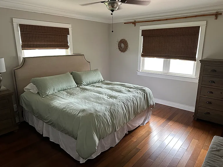 Primary bedroom with views of the large yard and pasture