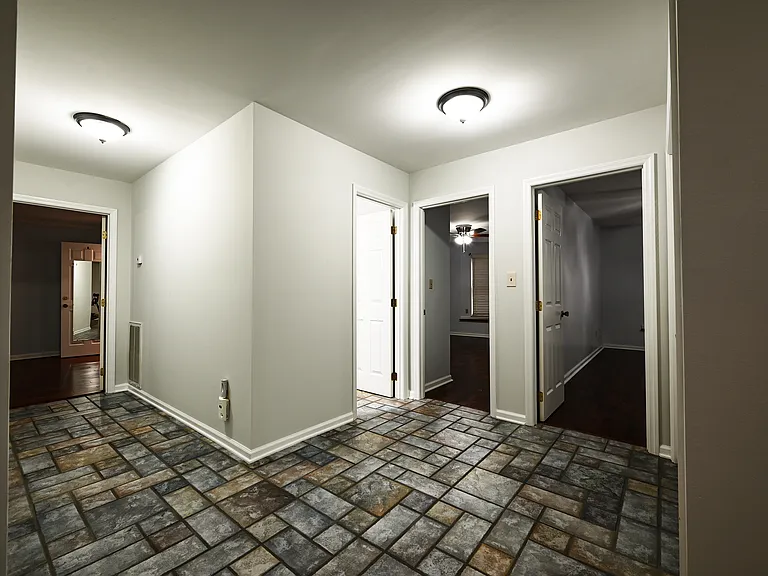 Hallway to bathroom, laundry and rooms