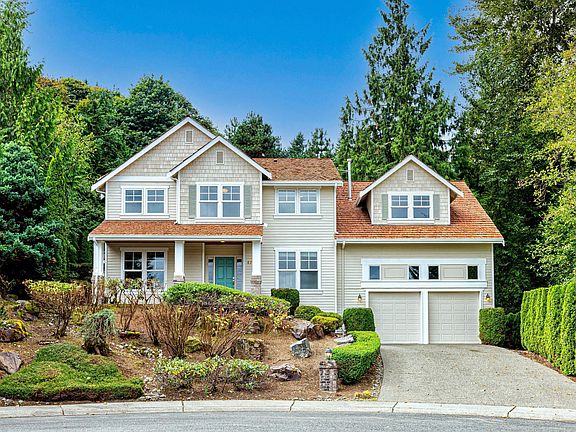 Home is located on a private street backed by green belt