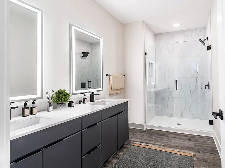 Premium home bathrooms at Modera Westside Trail feature spacious vanities and sleek finishes, offering a refined start and end to each day.