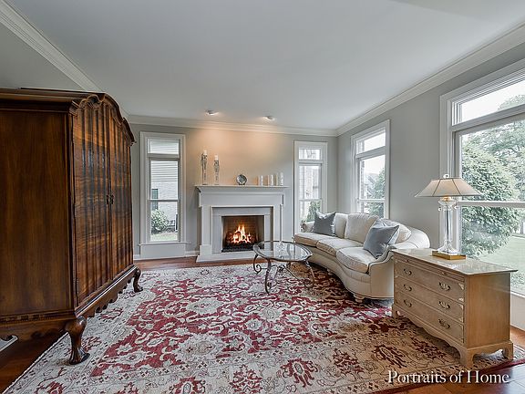 Lovely masonry Fireplace w/custom mantel, extensive trim detail & custom lighting.