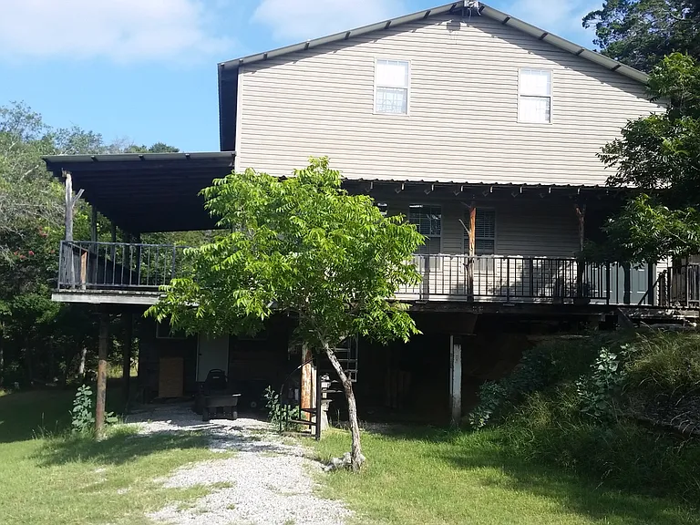 Carport parking with storage unit below
